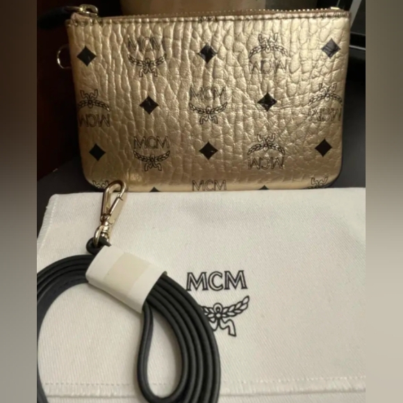 MCM Handbags - NWOT MCM Metallic Gold Zip Pouch W/ Strap